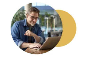 a merchant looking at his credit card processing fees on his laptop